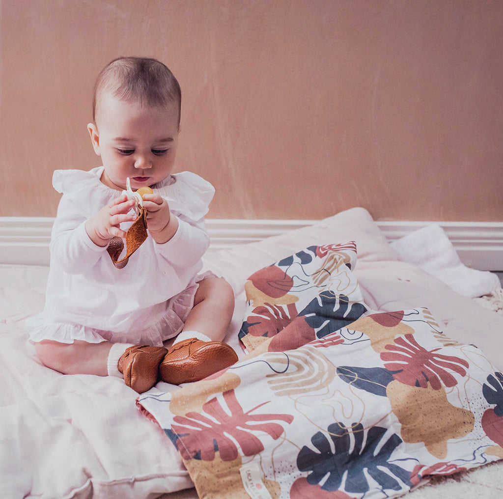 Baby muslin swaddle in botanical print